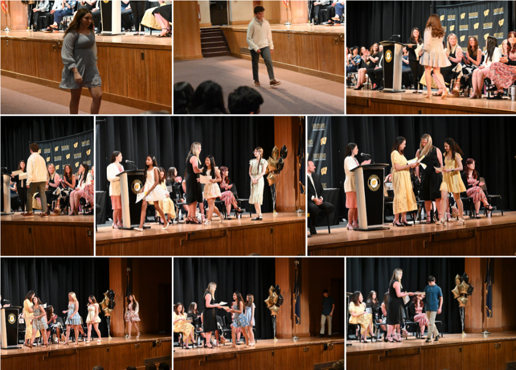 students receiving awards on stage